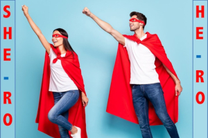 Image of a woman and man in a mask and superhero cape.